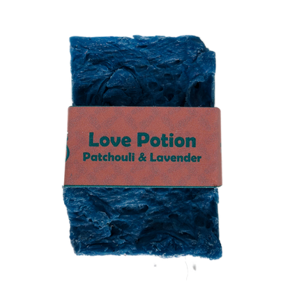 Single bar of Love Potion Patchouli and Lavender handmade soap by Bouncing Studio showing rustic blue texture
