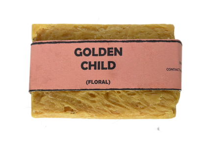 Golden Child floral handmade soap bar by Bouncing Studio showing golden yellow rustic texture from above on white background